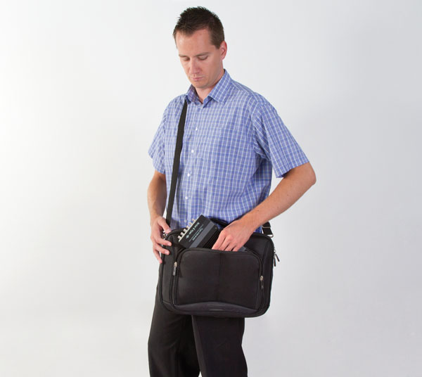 Man putting Lan-Xi module in bag