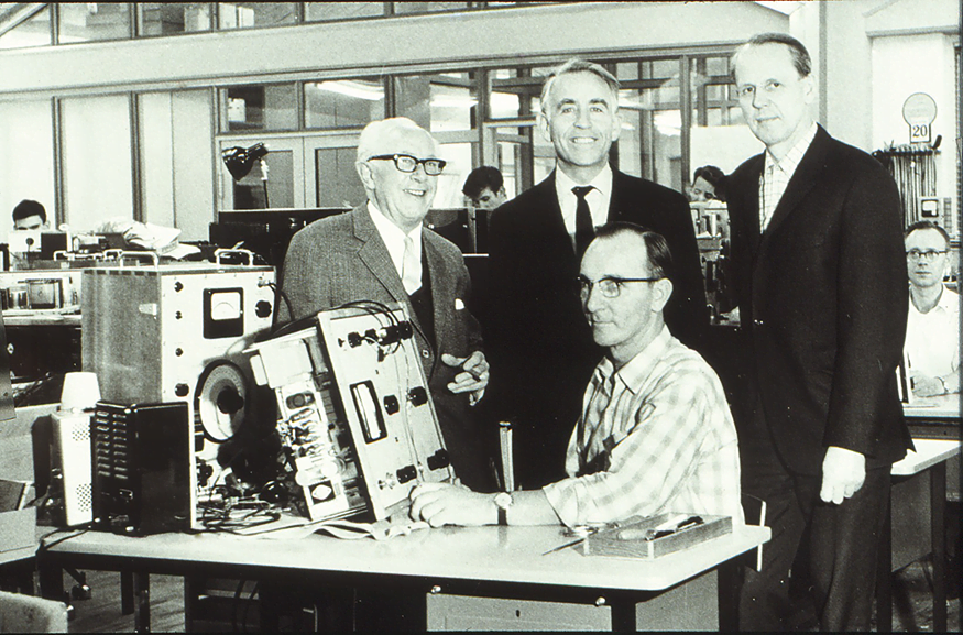 Founders Per V. Brüel (middle) and Viggo Kjær (right) with Production Manager Holger Nielsen