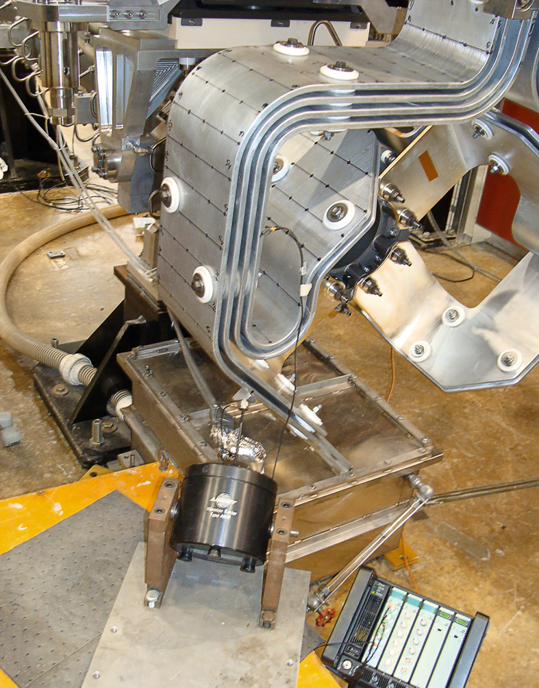 During actual electrical pulse testing, three miniature triaxial accelerometers were mounted on the stripline