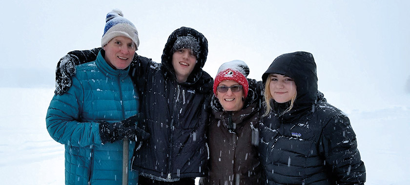 Sean Olive and one of his favourite pastimes – skating; seen here with his children and sister on a frozen lake in a snowstorm