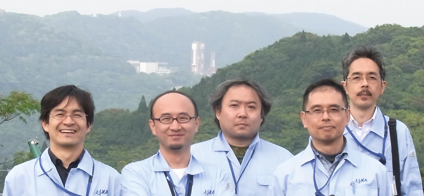 JAXA Engineers In front of Launchpad